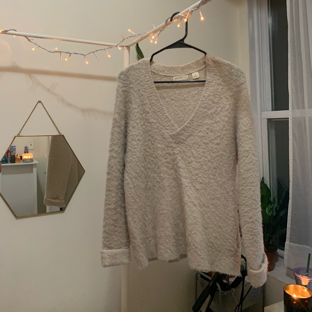Fluffy cream colored sweater
